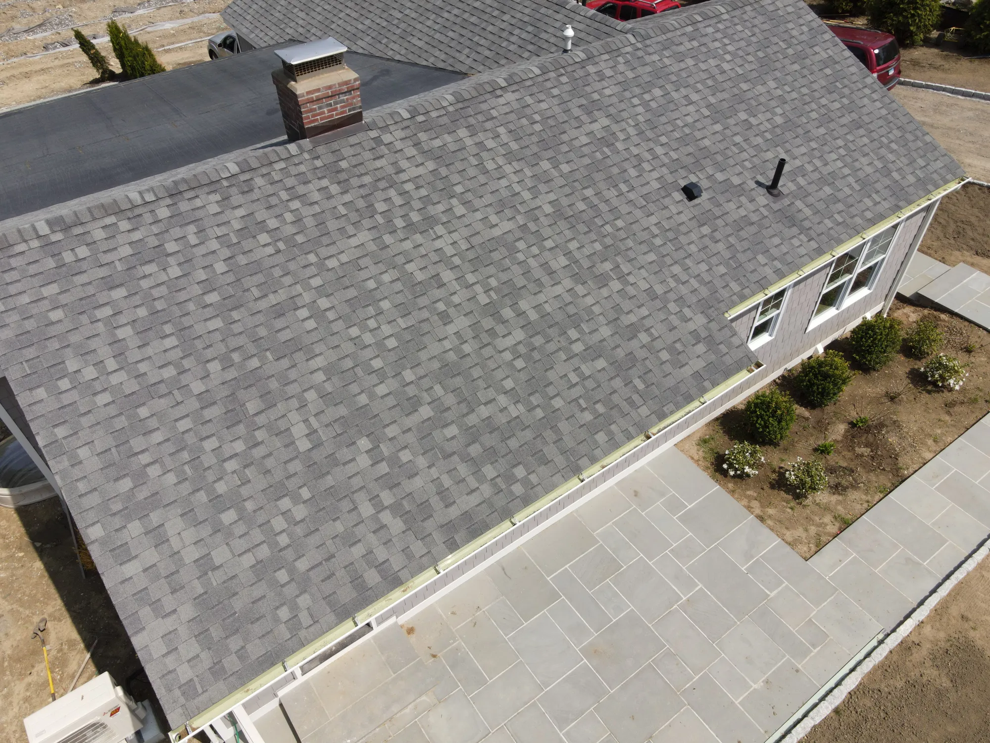 Aerial view of a completed asphalt shingle roof in Wilton CT